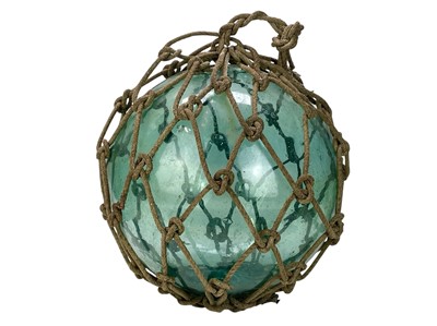 Lot 33 - Three large blown glass fishing floats.