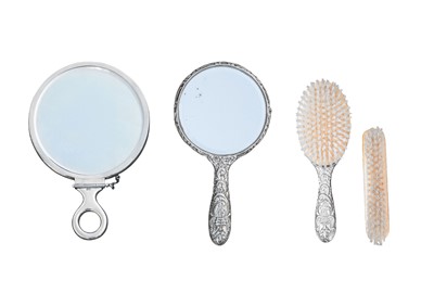 Lot 355 - A hallmarked silver handheld dressing table mirror.