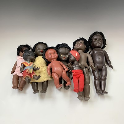 Lot 605 - DOLLS: A bag containg 8 black dolls of varying...