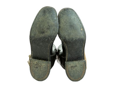 Lot 31 - A pair of black leather riding boots and trees.