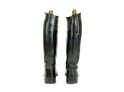 Lot 31 - A pair of black leather riding boots and trees.