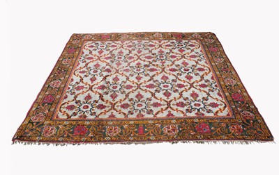 Lot 475 - An Indian carpet, the ivory field with all...