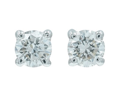 Lot 271 - A fine pair of 18k white gold solitaire 0.40ct diamond stud earrings.