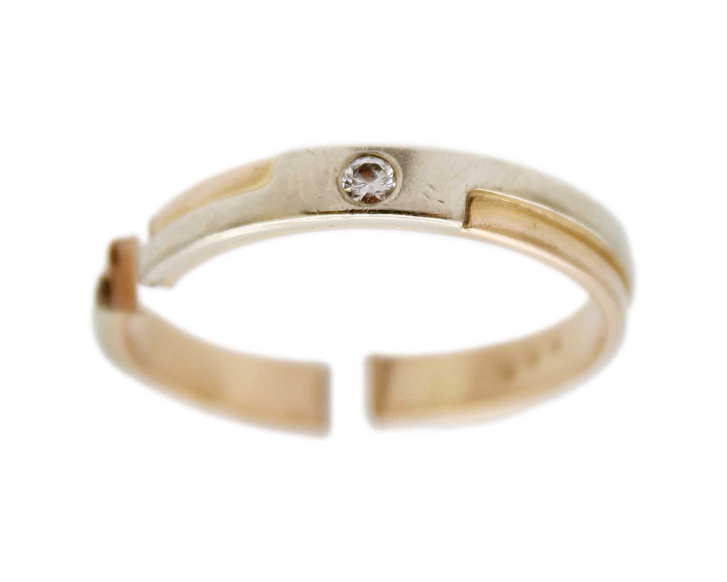 Lot 18 - A broken 14k bi-colour gold ring set with a diamond.