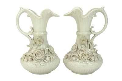 Lot 306 - A pair of Belleek 'Aberdeen' ewers.