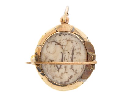 Lot 132 - An early Georgian gold and seed pearl set oval portrait miniature brooch pendant.
