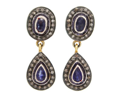 Lot 60 - A pair of silver gilt sapphire and diamond pendant earrings.