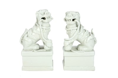 Lot 372 - A pair of Chinese blanc de chine Buddhistic lions.