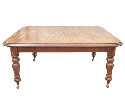 Lot 953 - A Victorian mahogany extending dining table.
