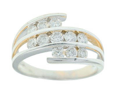Lot 244 - A 14k white gold and diamond dress ring.