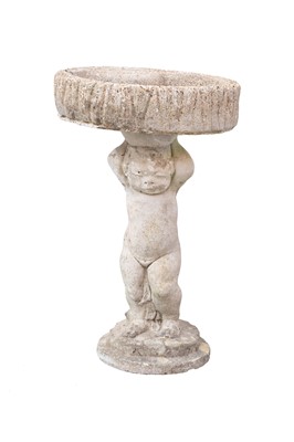 Lot 878 - A reconstituted stone bird bath of small proportions.