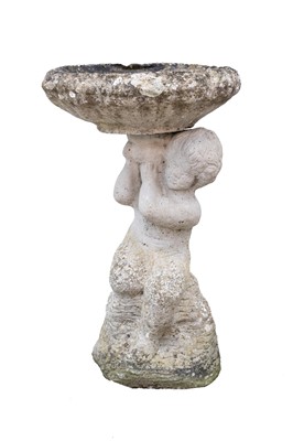 Lot 865 - A reconstituted stone bird bath.