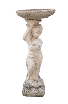 Lot 875 - A composition stone bird bath, the figural column modelled as a putto holding a cornucopia aloft.