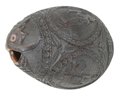 Lot 742 - A carved coconut bugbear money box.