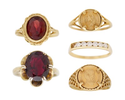 Lot 167 - A selection of five 9k gold rings, two set with garnets.