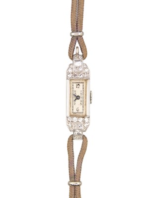 Lot 617 - An Art Deco Swiss platinum with gold, diamond-set cocktail watch/pendant.