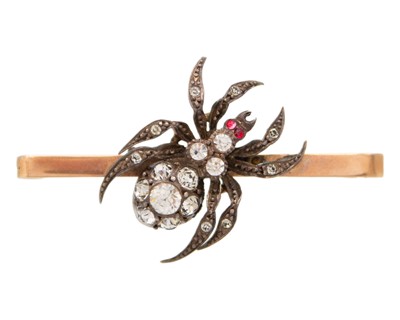 Lot 192 - A 9k gold, silver, and paste spider bar brooch, boxed.