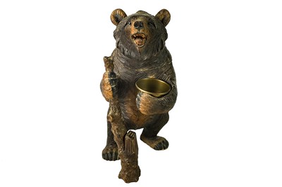 Lot 36 - A Black Forest carved bear tobacco jar.