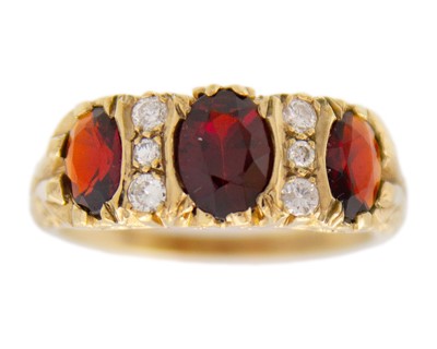 Lot 77 - A Victorian style 9k gold garnet and diamond ring.