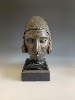 Lot 1276 - A bronzed study of a female head, on wooden...