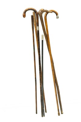 Lot 27 - Two silver mounted canes, another, a swagger stick, and two cleaning rods.