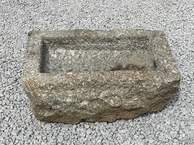 Lot 879 - A weathered granite trough.