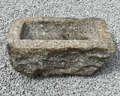 Lot 866 - A weathered granite trough.