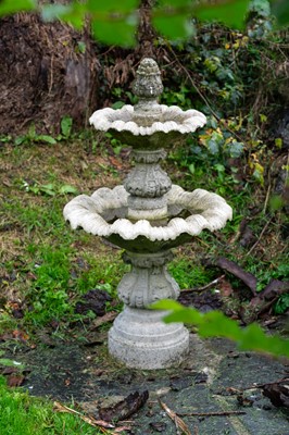 Lot 880 - A reconstituted stone two-tier fountain.