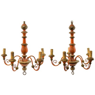 Lot 797 - A pair of painted and gilt wood five branch electroliers.