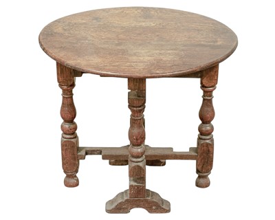 Lot 765 - A circular joined oak drop top occasional table.