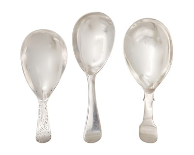 Lot 34 - A selection of three George III silver caddy spoons.