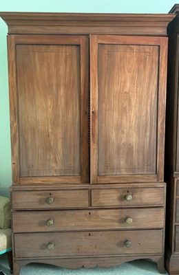 Lot 3147 - A late George III mahogany linen press, the...