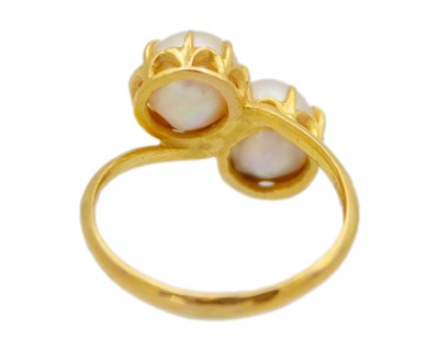 Lot 46 - A higher-purity gold, two-cultured pearl Toi Et Moi ring.