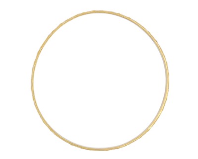 Lot 8 - A high-purity gold faceted bangle.