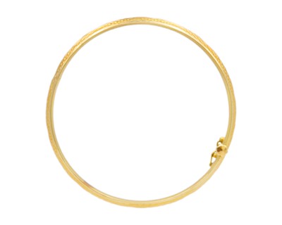 Lot 14 - A higher purity gold hinged bangle.