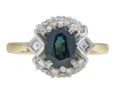 Lot 7 - An 18k gold teal sapphire and diamond cluster ring.