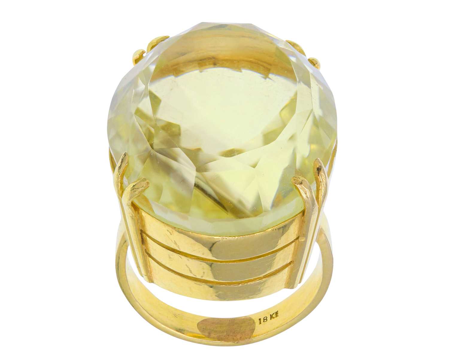 Lot 4 - A heavy 18k gold 50ct citrine set dress ring.