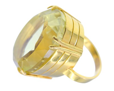 Lot 4 - A heavy 18k gold 50ct citrine set dress ring.