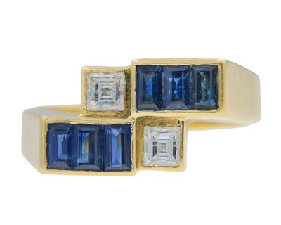 Lot 12 - An 18k gold sapphire and diamond geometrical design ring.