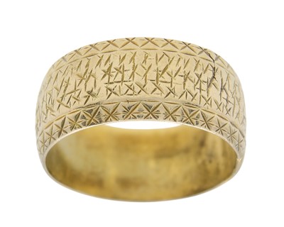 Lot 23 - A 9k gold wide engraved band ring.