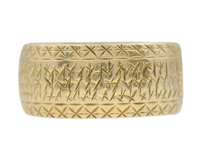 Lot 23 - A 9k gold wide engraved band ring.
