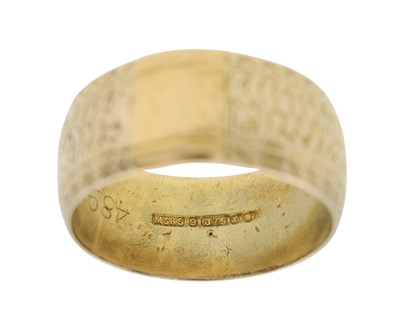 Lot 23 - A 9k gold wide engraved band ring.