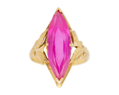 Lot 93 - A 22k gold and synthetic pink sapphire dress ring.