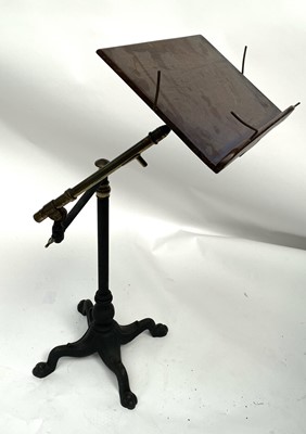 Lot 3047 - An Edwardian walnut, brass and iron reading...
