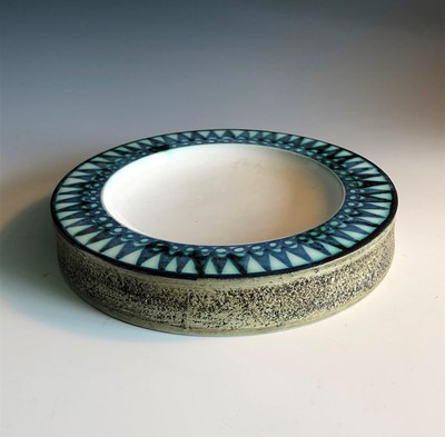 Lot 374 - A Troika pottery round ashtray with blue under...