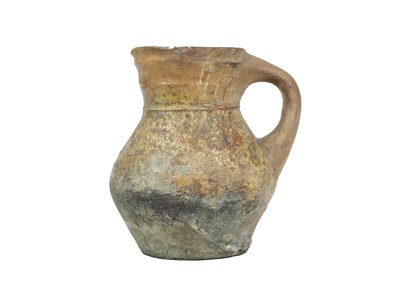 Lot 596 - An English medieval pottery jug.