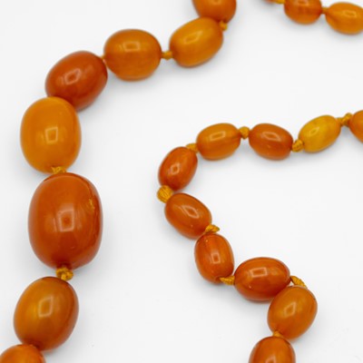 Lot 37 - A butterscotch amber-style graduated bead necklace.