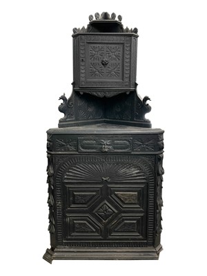 Lot 992 - A Victorian carved oak standing corner cupboard.