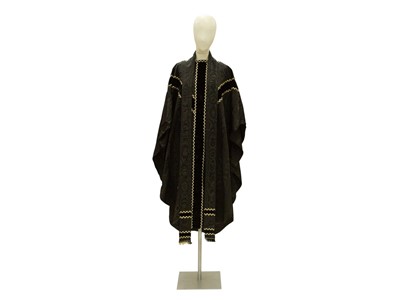 Lot 531 - Liturgical Vestments - a black chasuble with monochrome border.
