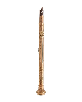 Lot 212 - A 9k rose gold combination propelling pencil and dip pen with foliate scroll engraved decoration.